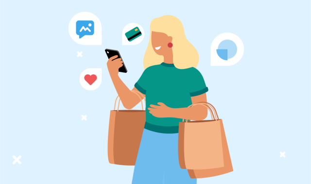 Woman with shopping bags looking at mobile phone 