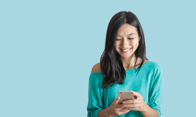 image of girl with phone smiling