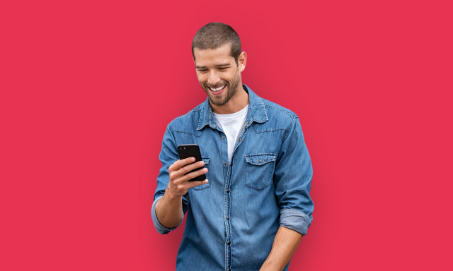 image of man holding iphone with red background